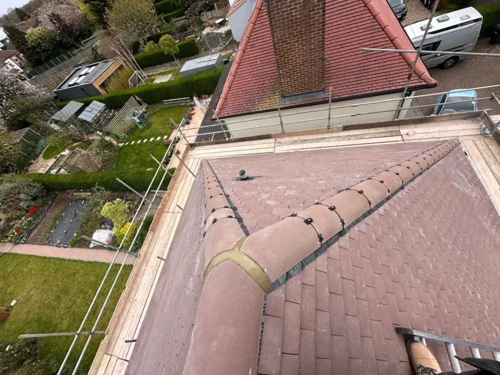 Roofers in North London: high view of a finished hipped tile roof and garden