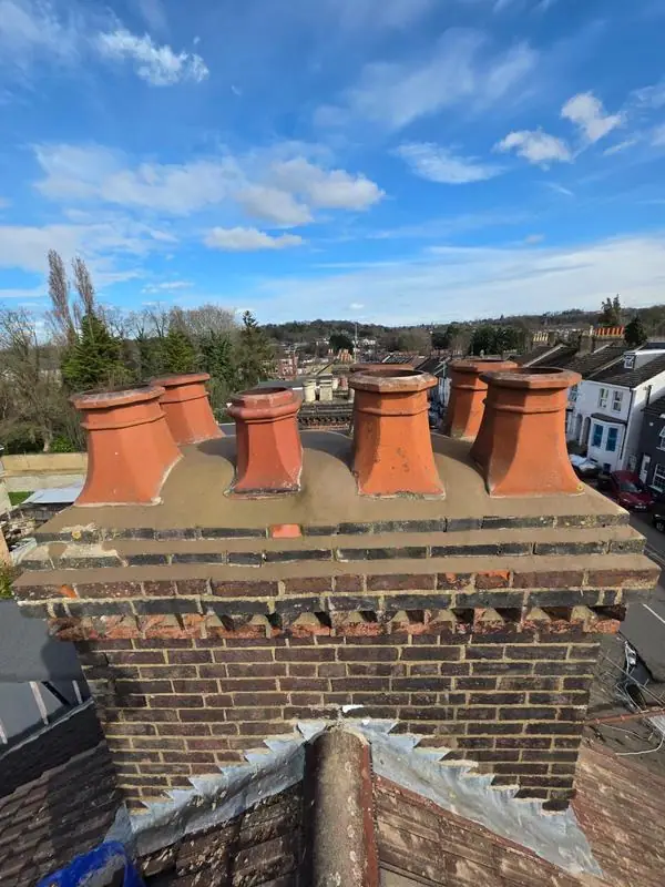 Chimney stack with a row of terracotta pots