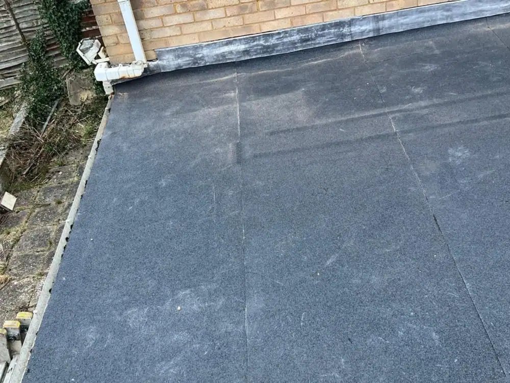 Finished felt flat roof at a corner abutment