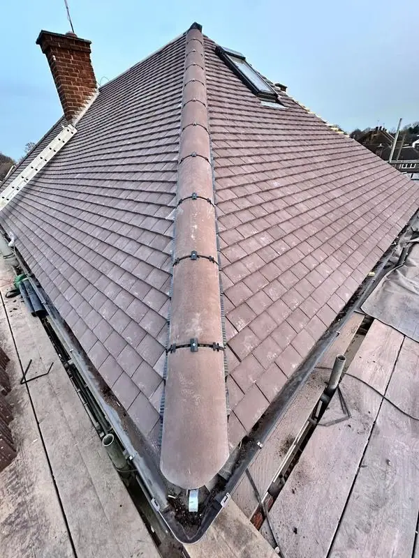Roofers in Watford: finished hip roof with new ridge, seen from the scaffold