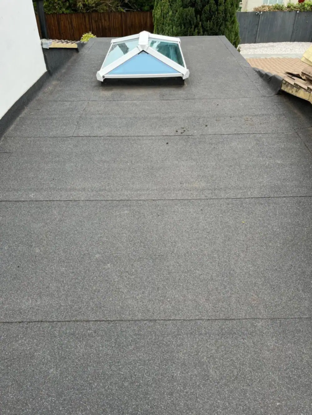 Flat roofing finished: a new flat roof with a glazed roof lantern