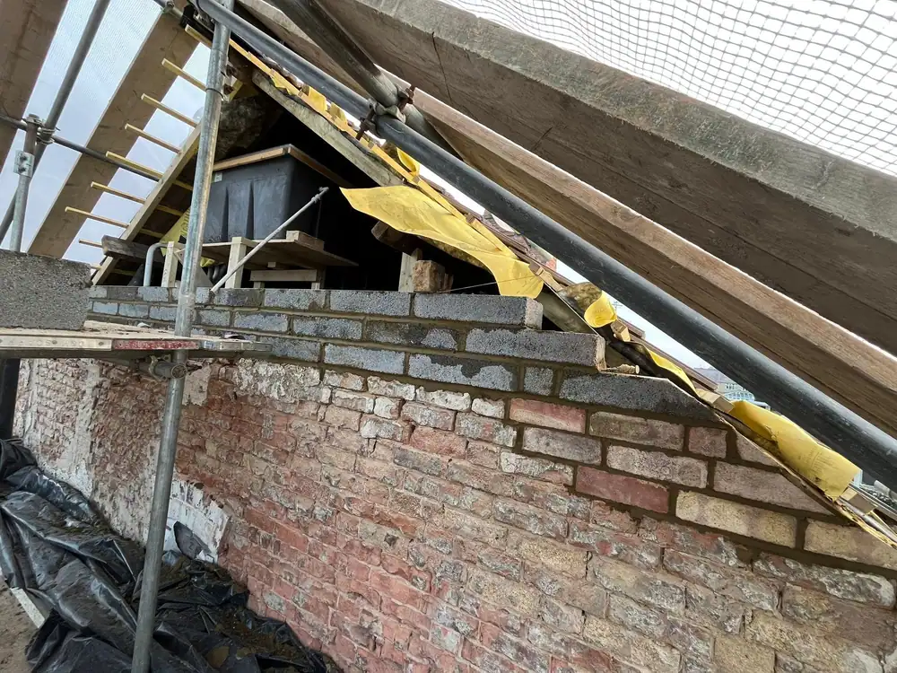 New blockwork going up on a gable under scaffold