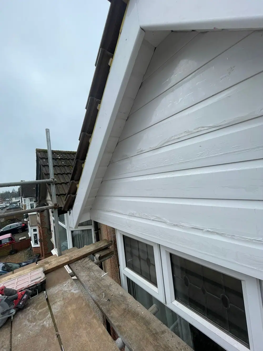 Side view of the new white gable cladding