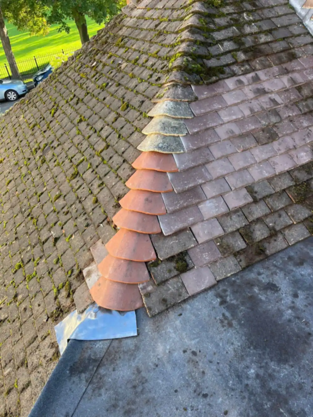 New lead and tiles at a hip on an older tiled roof
