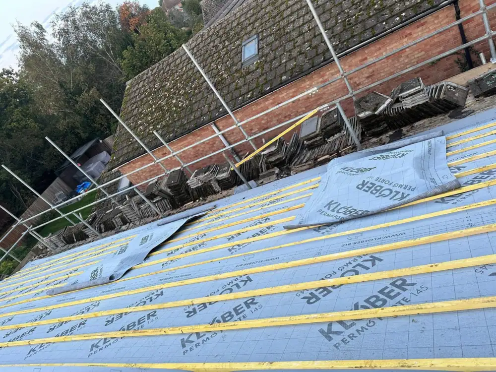 Roofers in Pinner: wide view of the battened roof over Klober membrane with scaffold