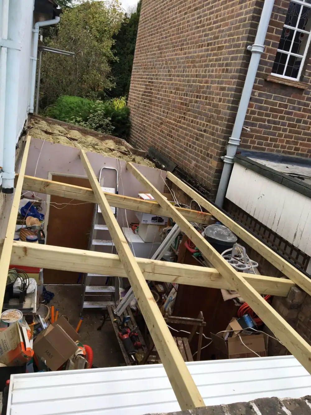 New timber joists laid for an extension flat roof ready for the deck