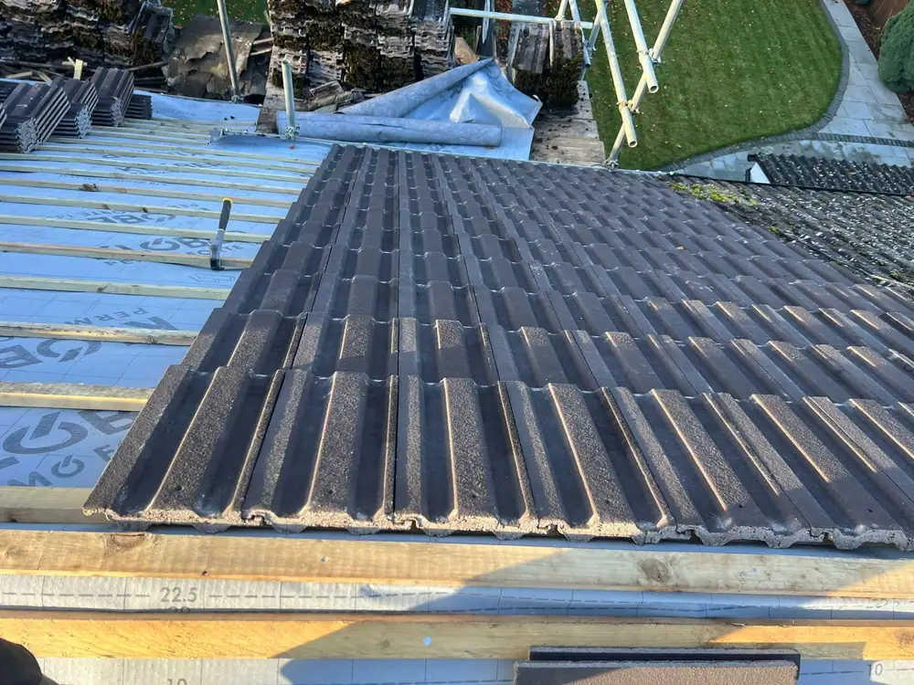 Roofers in Enfield: new tiles going on over membrane and battens