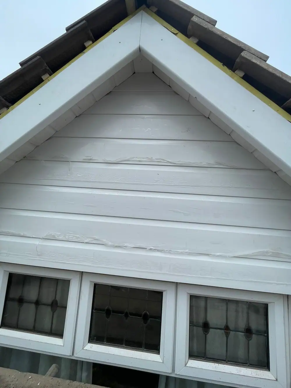 New white uPVC cladding and barge boards on a front gable