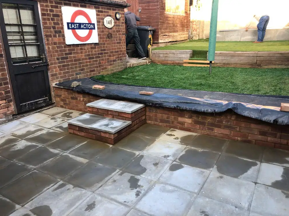 New patio, steps and artificial lawn in a rear garden