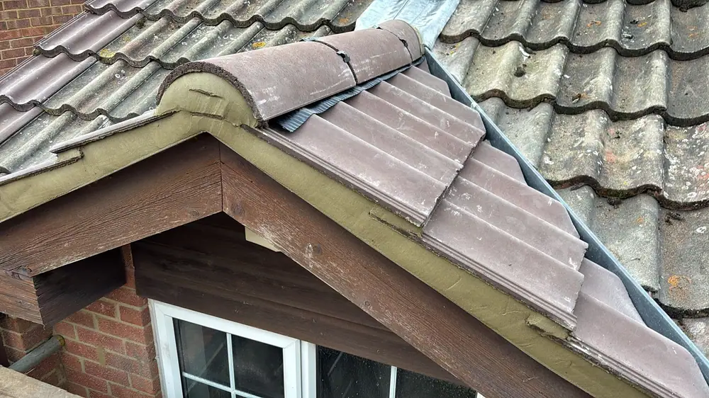Small gable roof with new tiles and ridge
