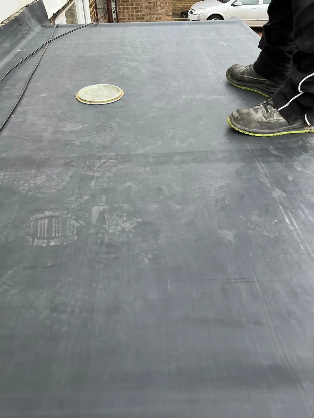 Finished rubber flat roof with an outlet