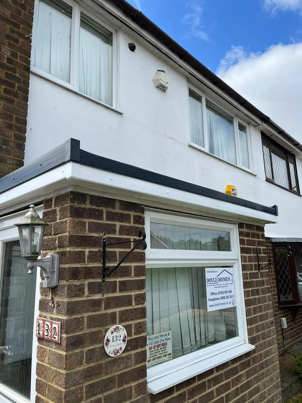 Semi-detached house with a new flat roof over the front bay and porch