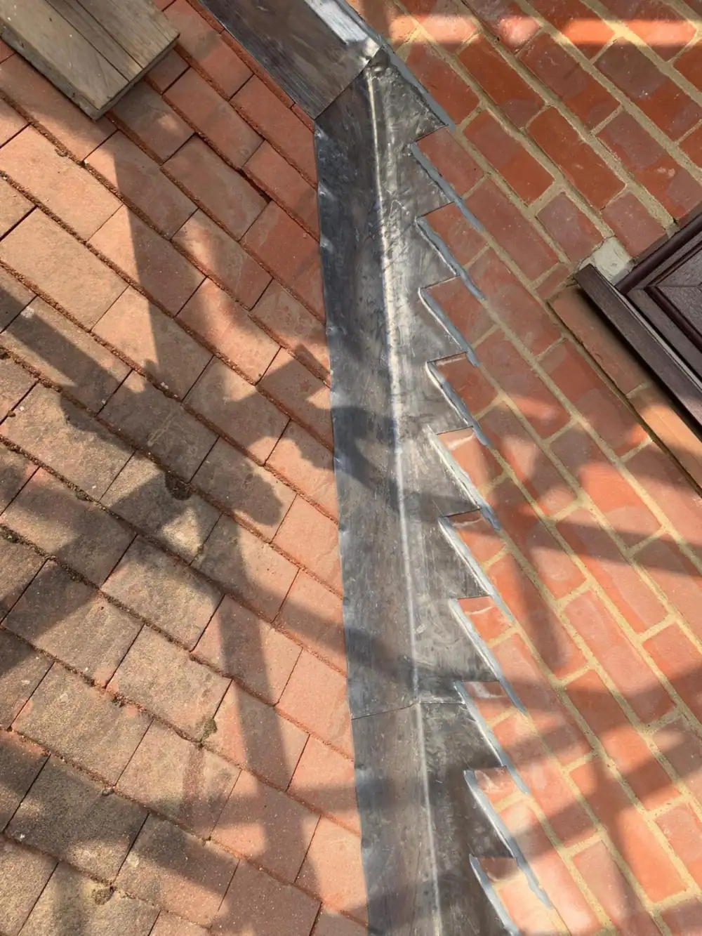 Close-up of new stepped lead flashing