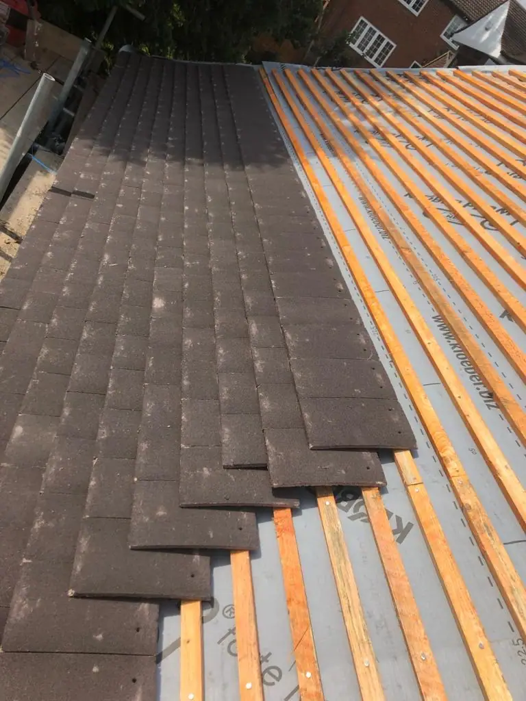 New tiles going onto fresh battens