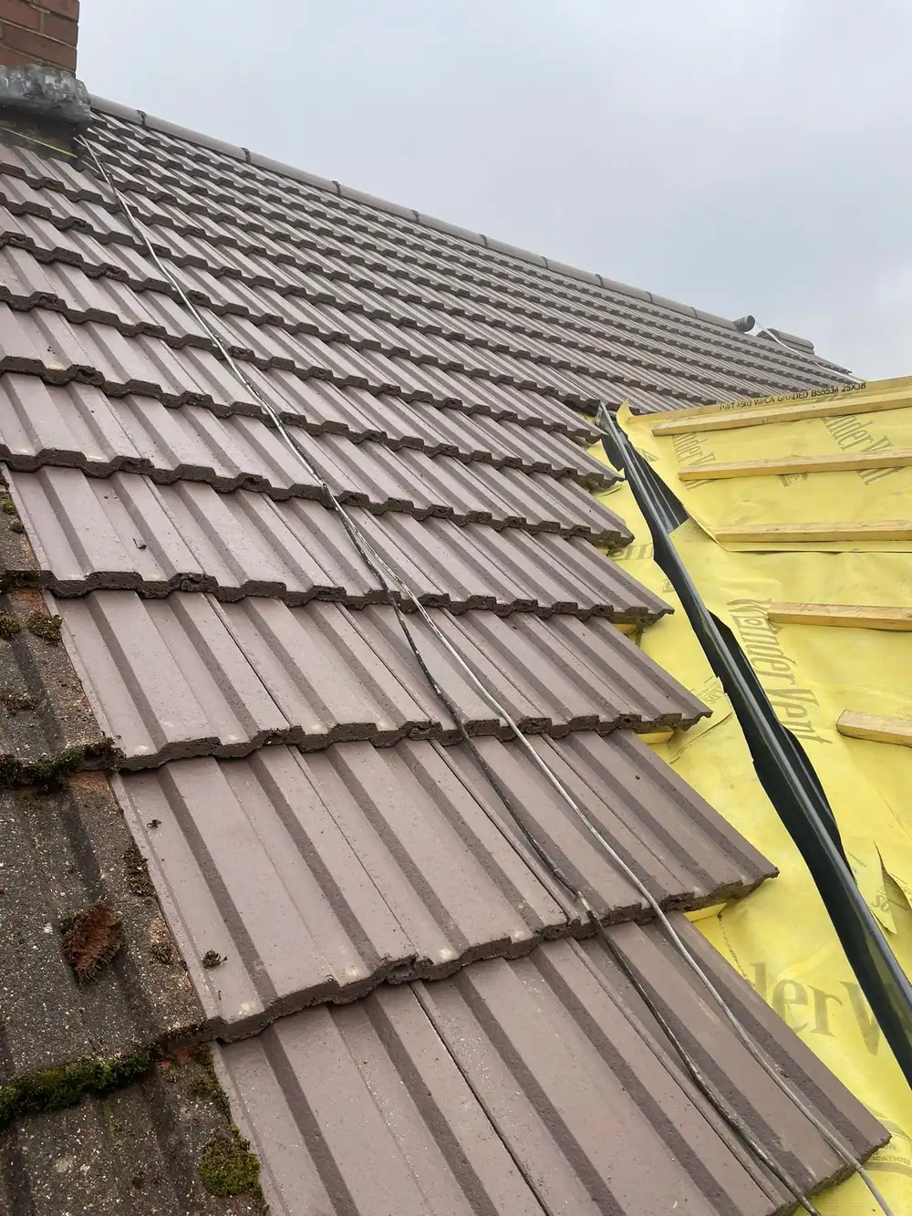 Valley being tiled over yellow membrane